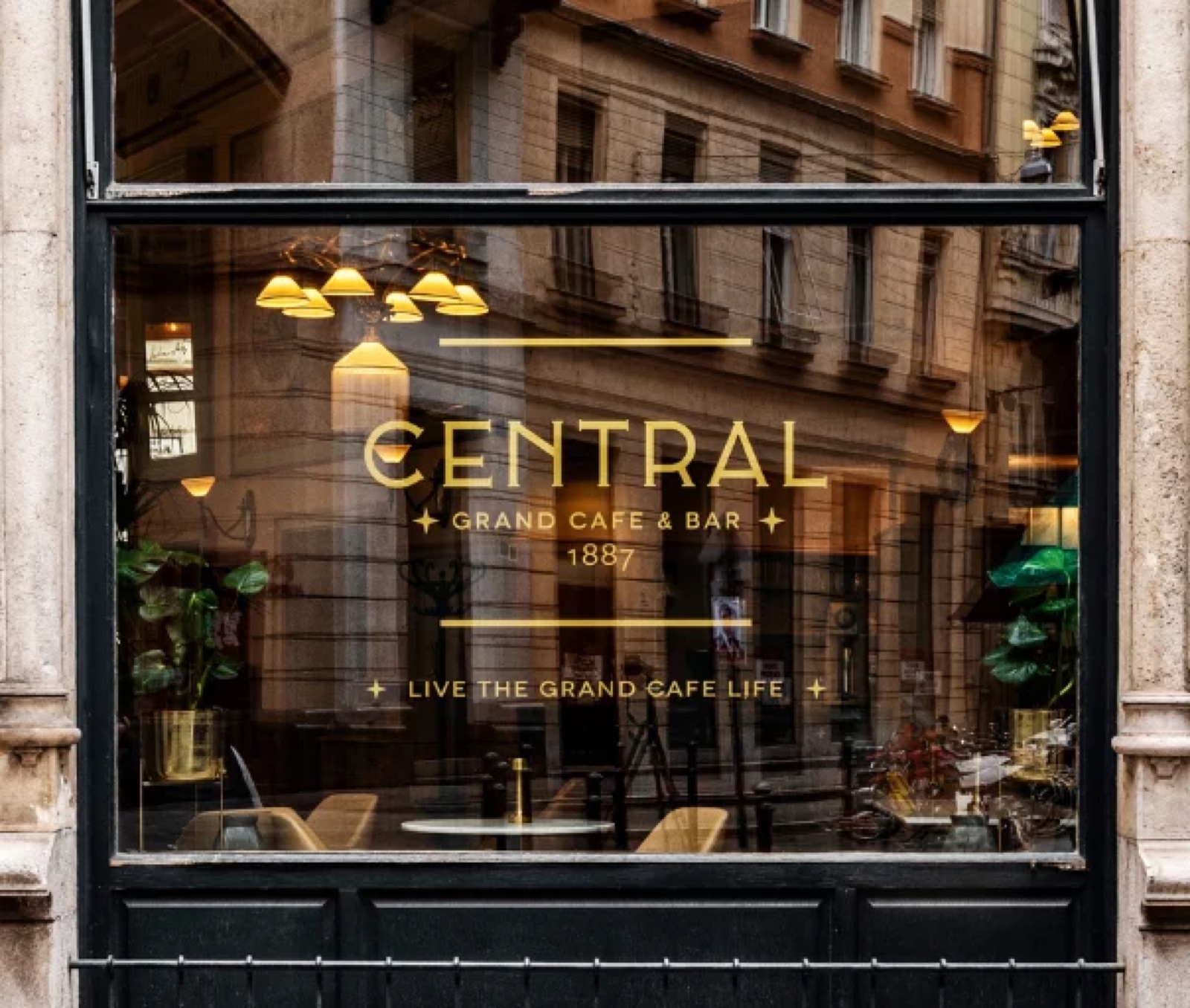 Gold lettering of the Central Grand Café on its shop window