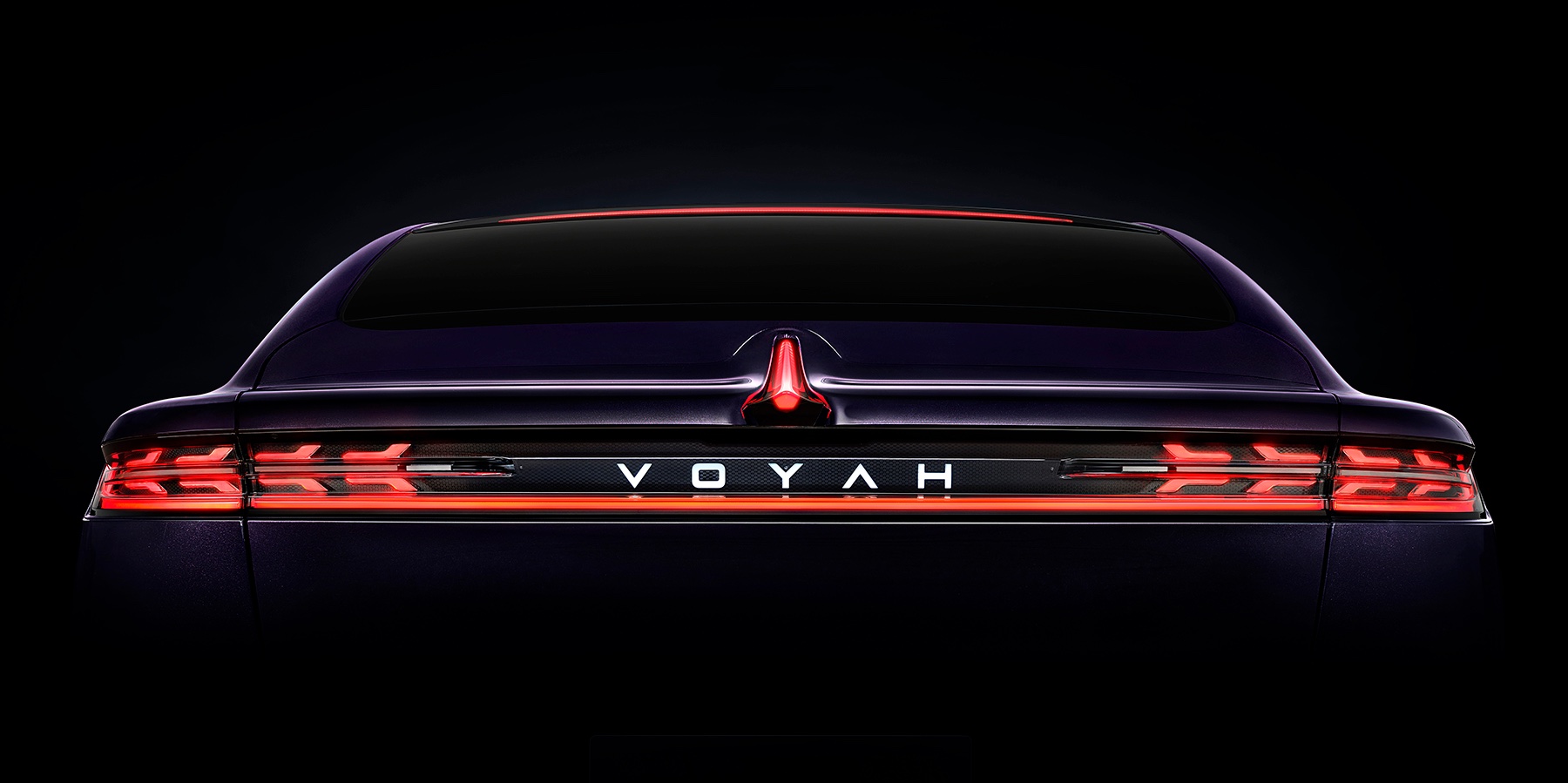 VOYAH electric car from behind, with its tail lights on